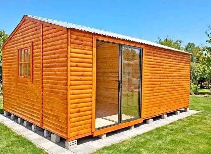 Newly built wooden Wendy house in a garden