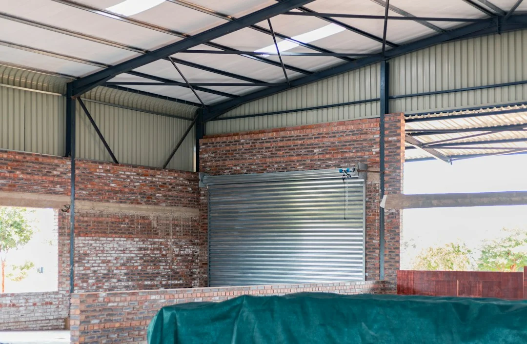 Steel carport structure built over a residential driveway